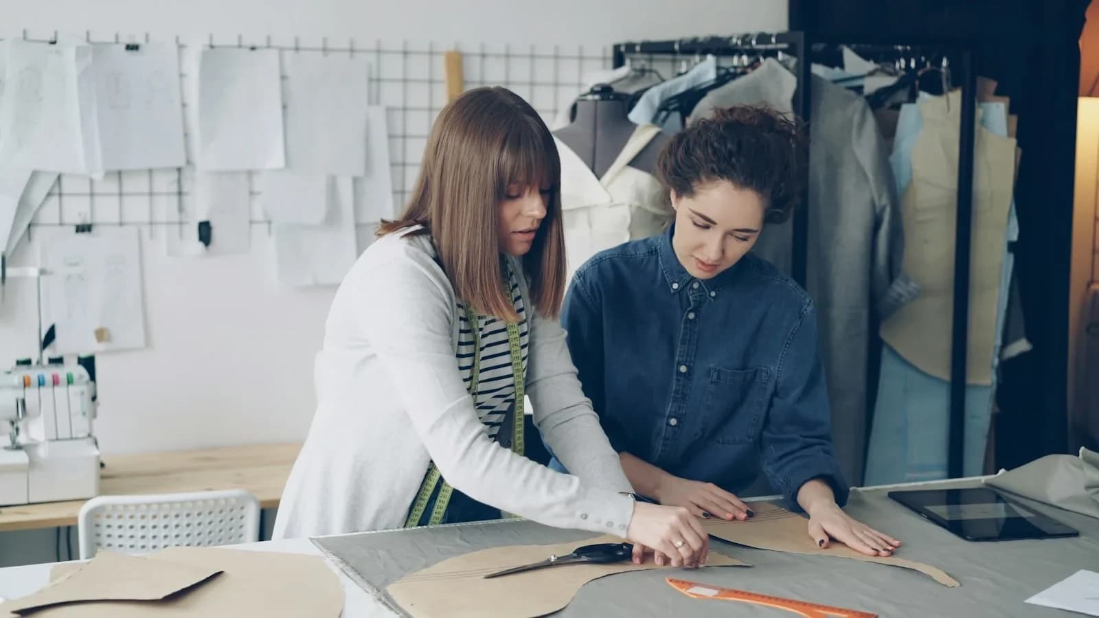 Small business team reviewing a project‑management board on a laptop