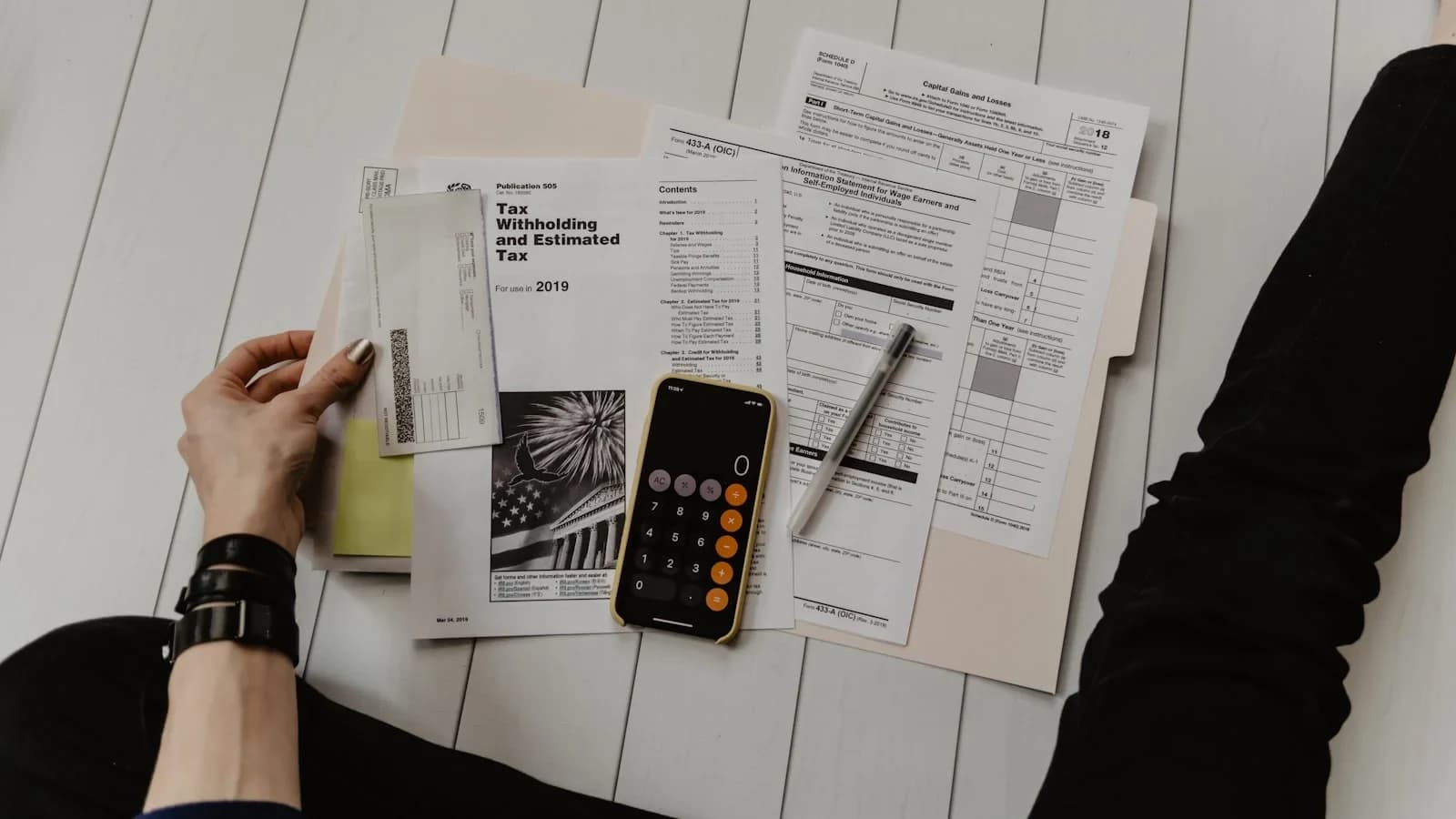 Small‑business owner reviewing a sales‑tax checklist on a laptop
