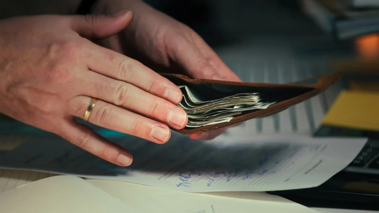 Small business owner reviewing a weekly cash‑flow forecast at a desk