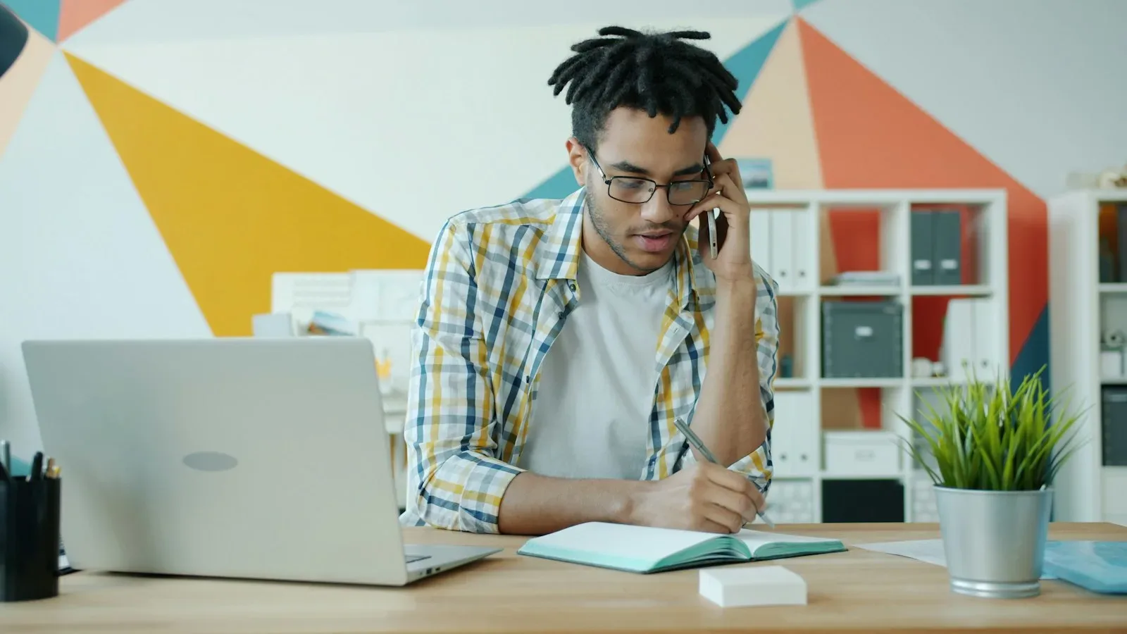 Small‑business owner and manager discussing employee termination in a private office