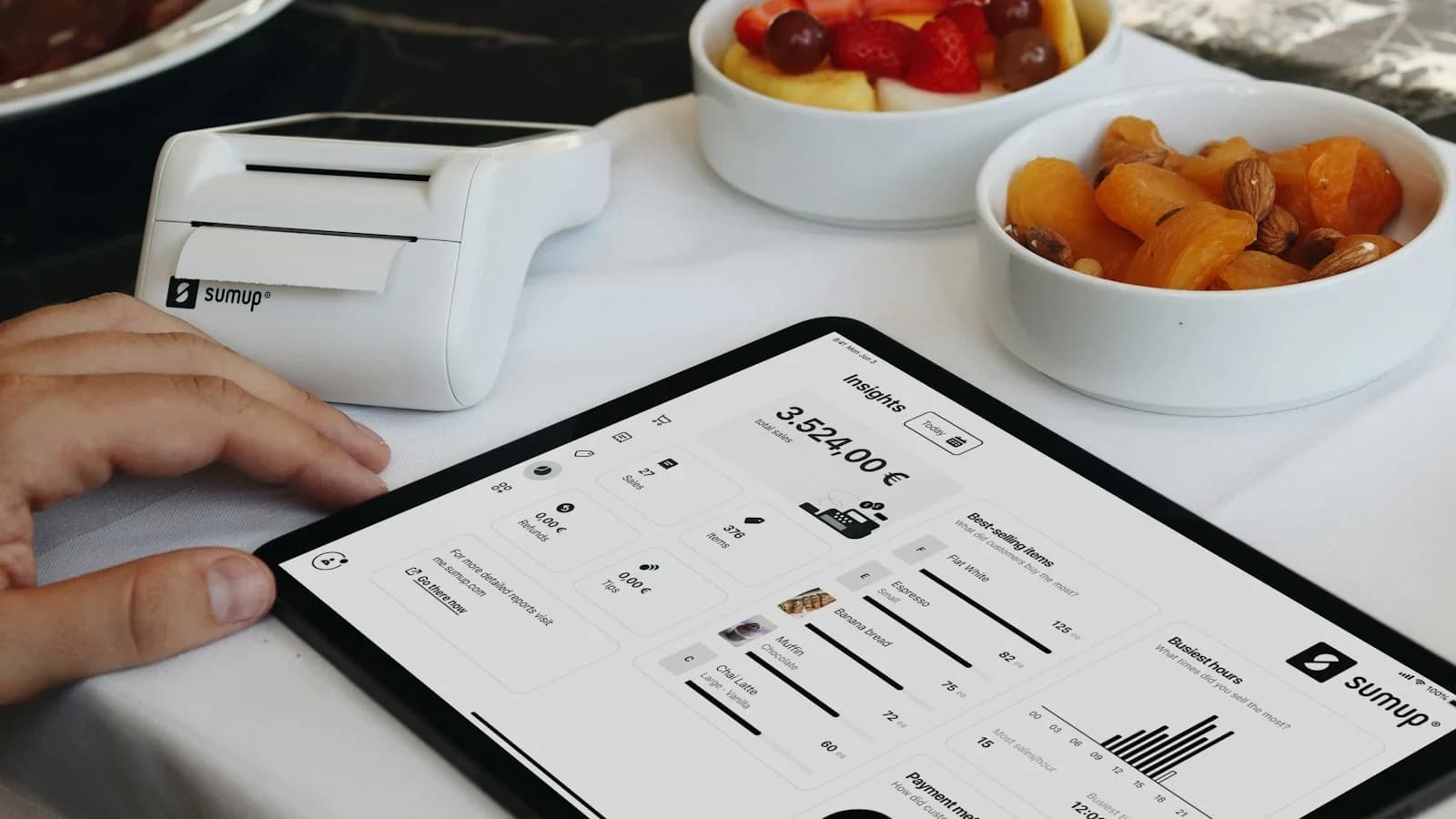 Small business owner reviewing job profitability reports on a laptop