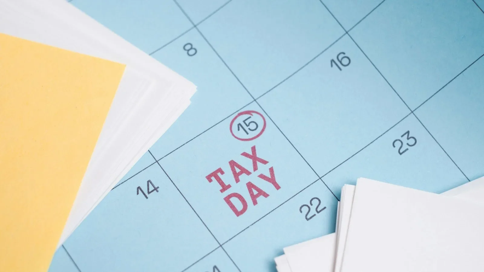 Small business owner reviewing payroll tax deposits with IRS portal on laptop