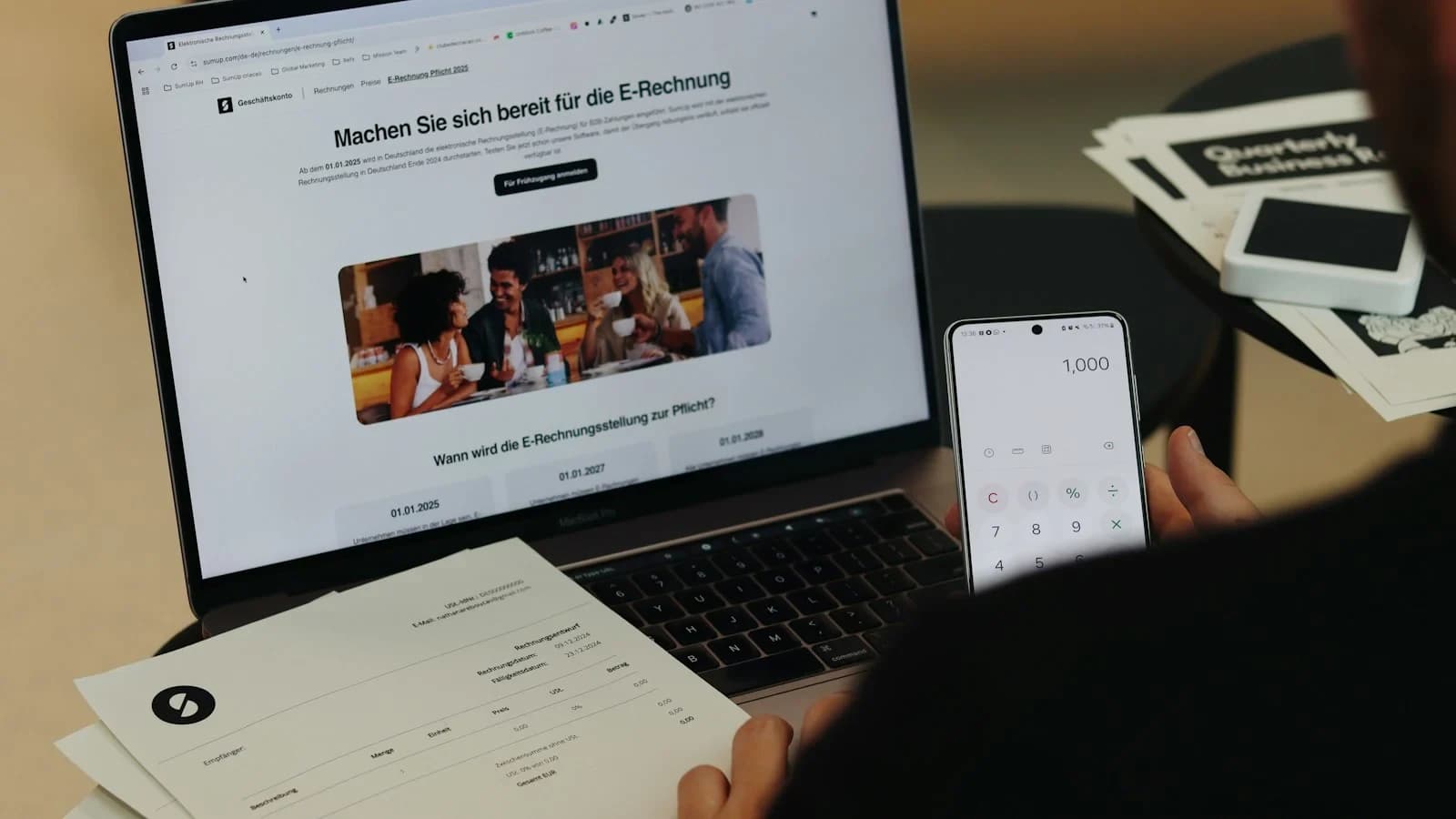 Small business owner reviewing a negative online comment and planning a response