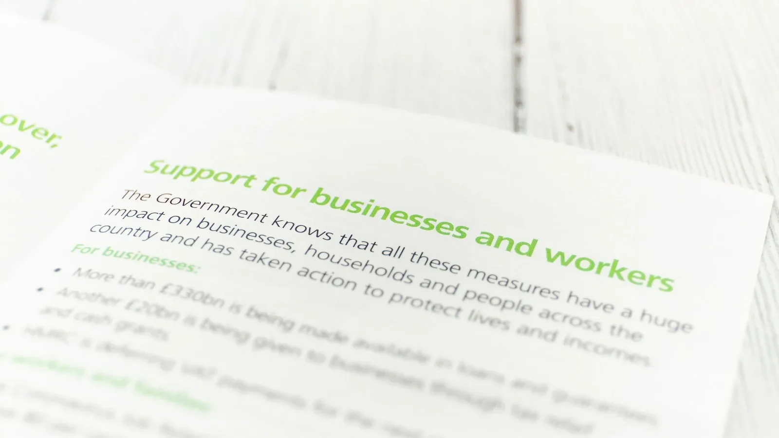 Small business owner reviewing supplier price increase notices