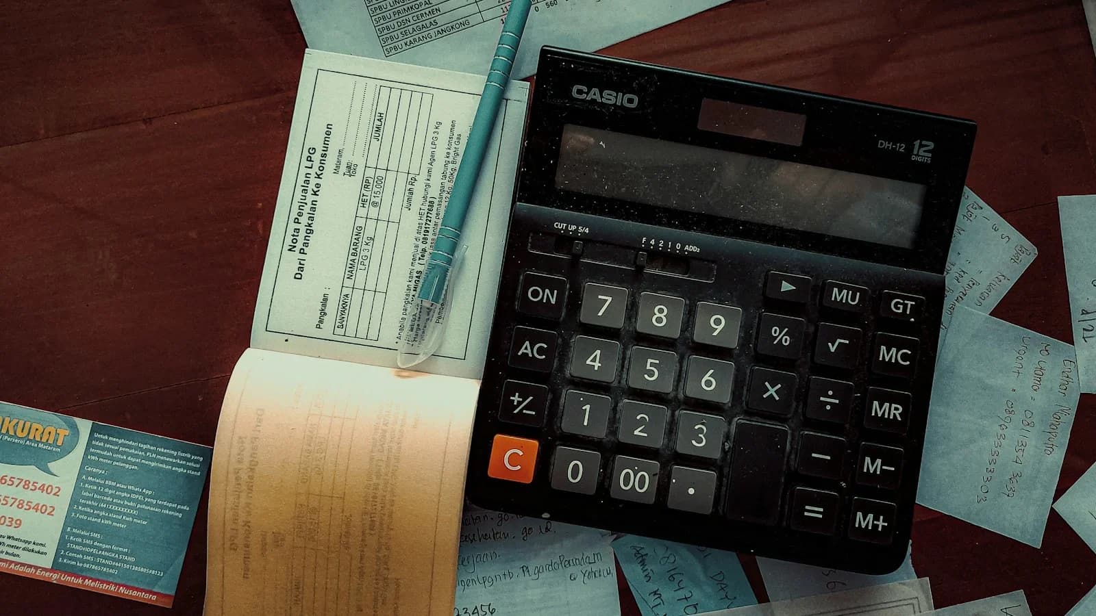Busy owner consulting with a professional bookkeeper in a modern office