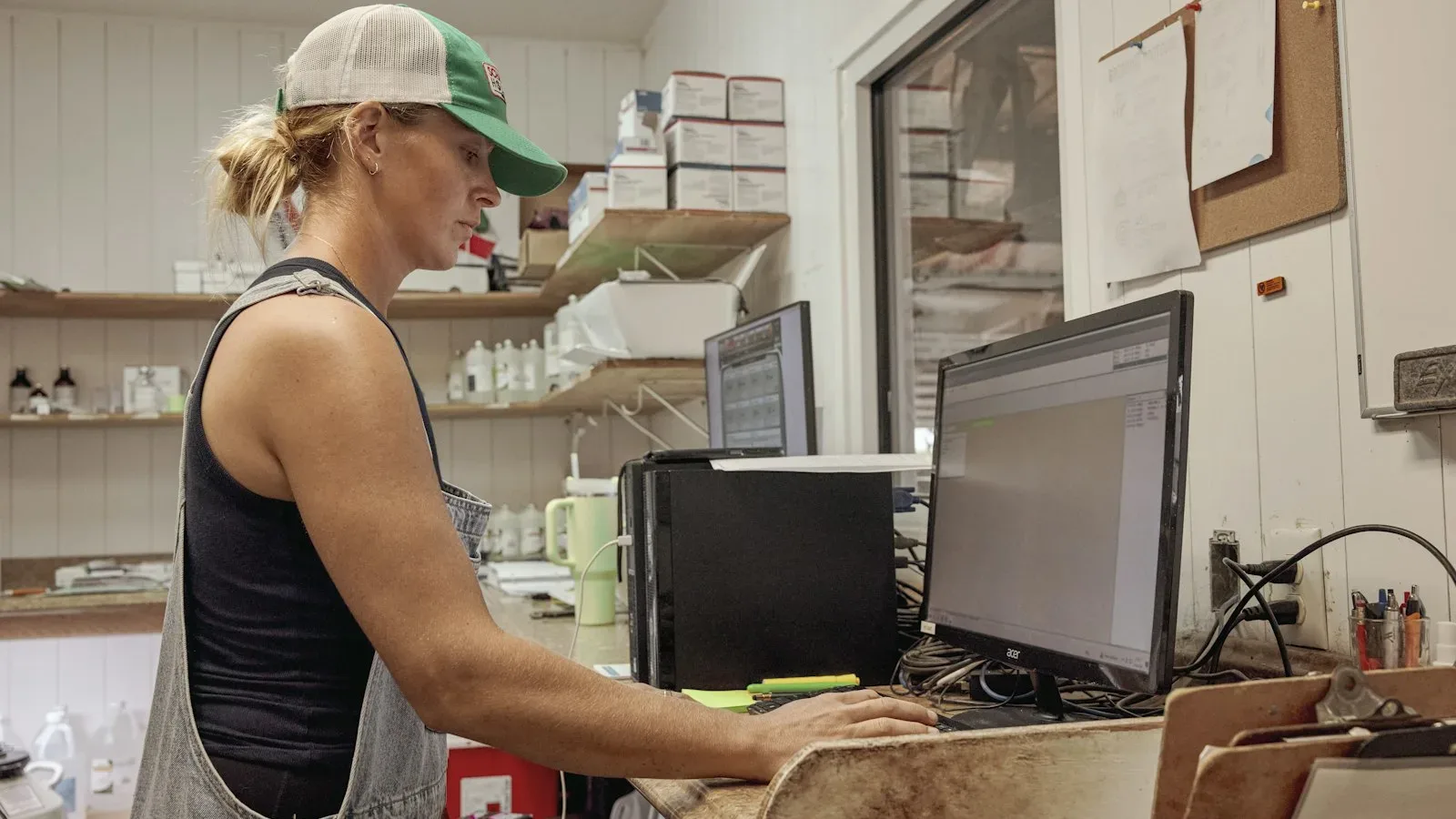 Small business owner reviewing weekly job profitability dashboard