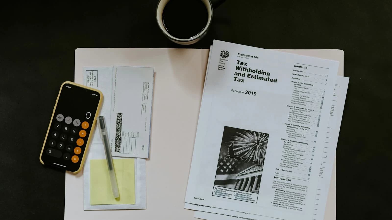 Small‑business owner reviewing a sales‑tax checklist in a bright office