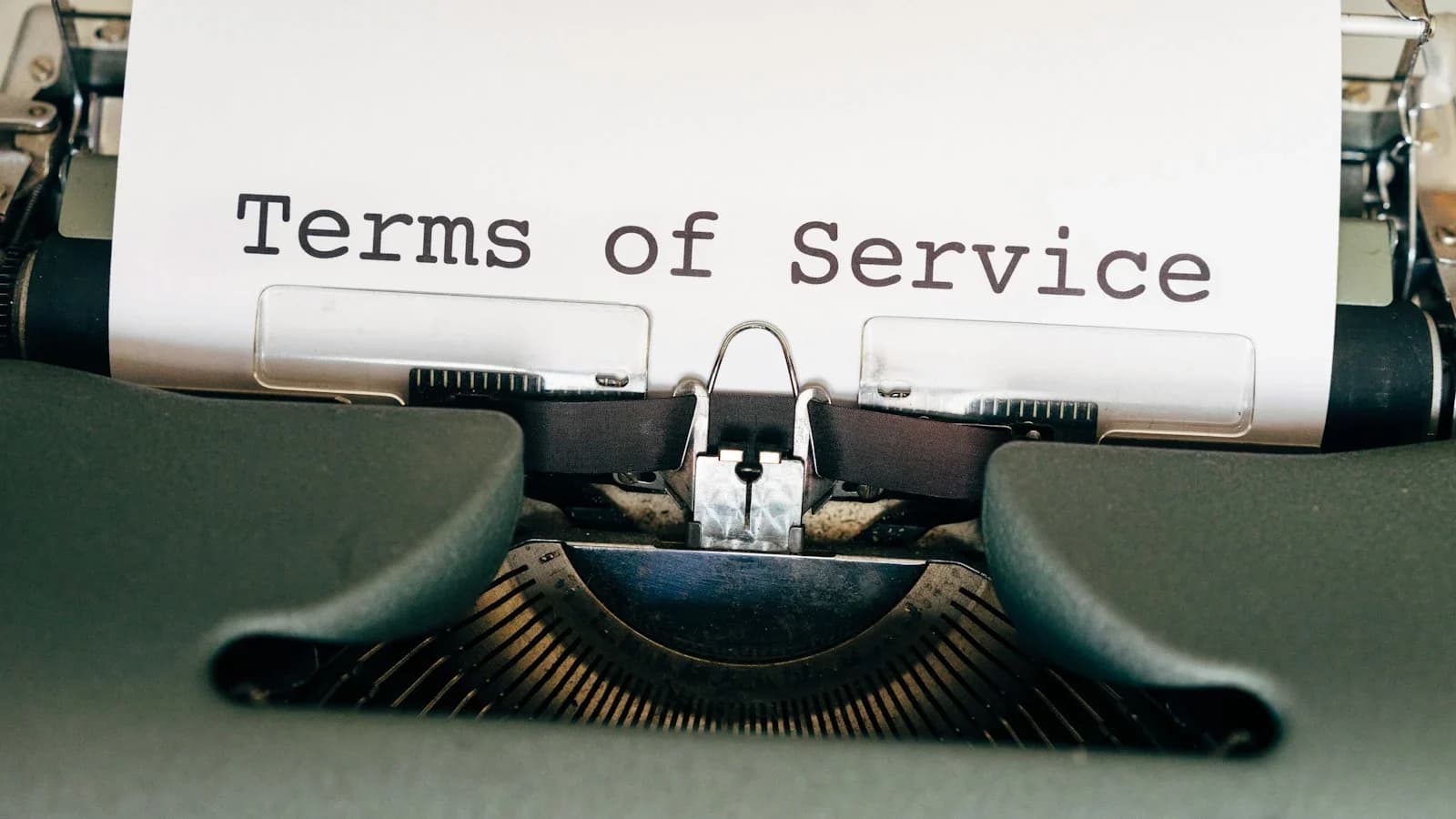 Small business owner reviewing vendor payment terms checklist at a desk