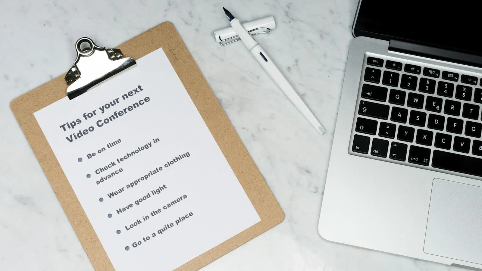 Small business owner reviewing vendor payment terms checklist with cash‑flow data
