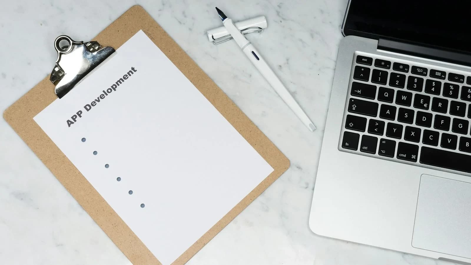 Small‑business owner conducting a lawful termination meeting with a checklist