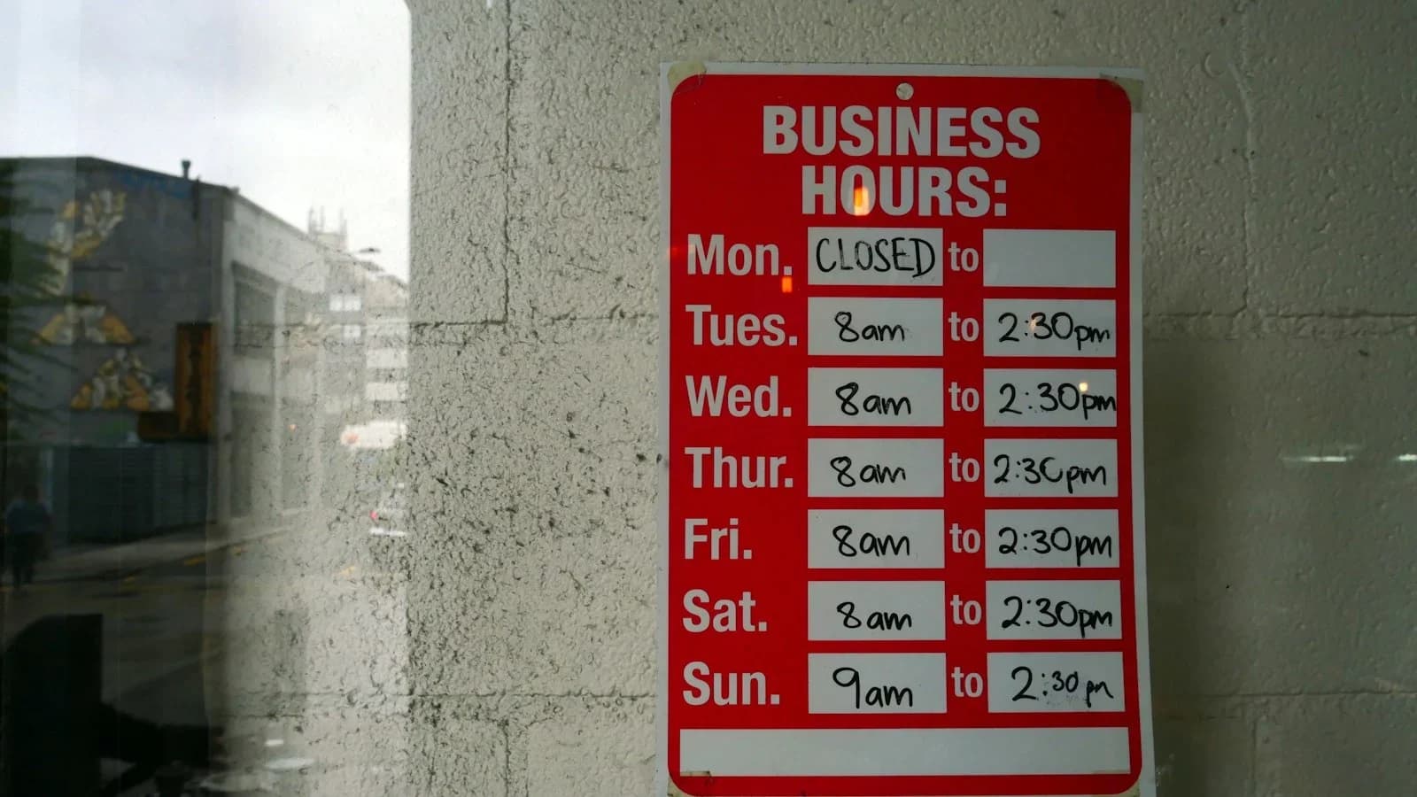 Small business manager reviewing overtime reduction dashboard with team